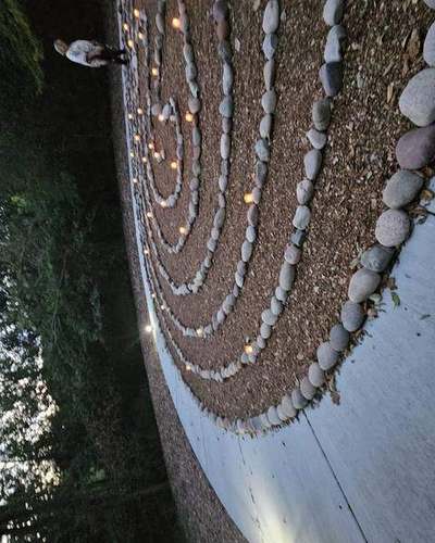 Close view of the labyrinth stones with candles burning between them